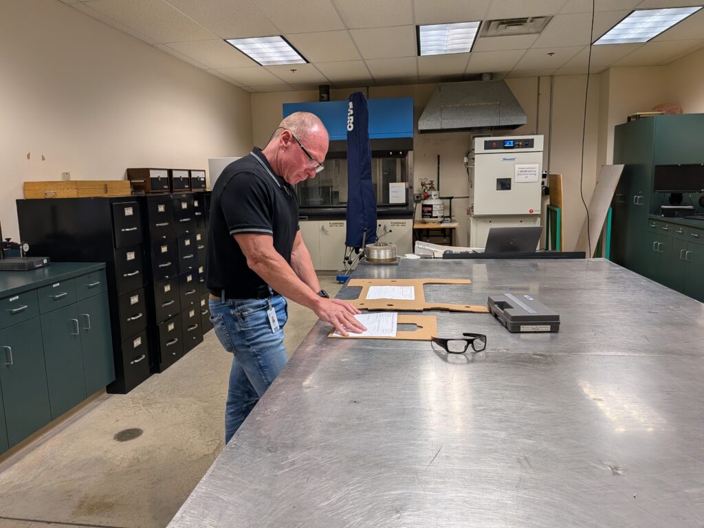 Quality engineer assessing product quality